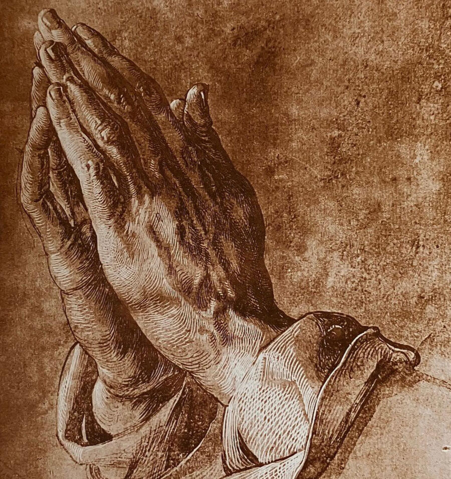 A pair of hands folded in prayer