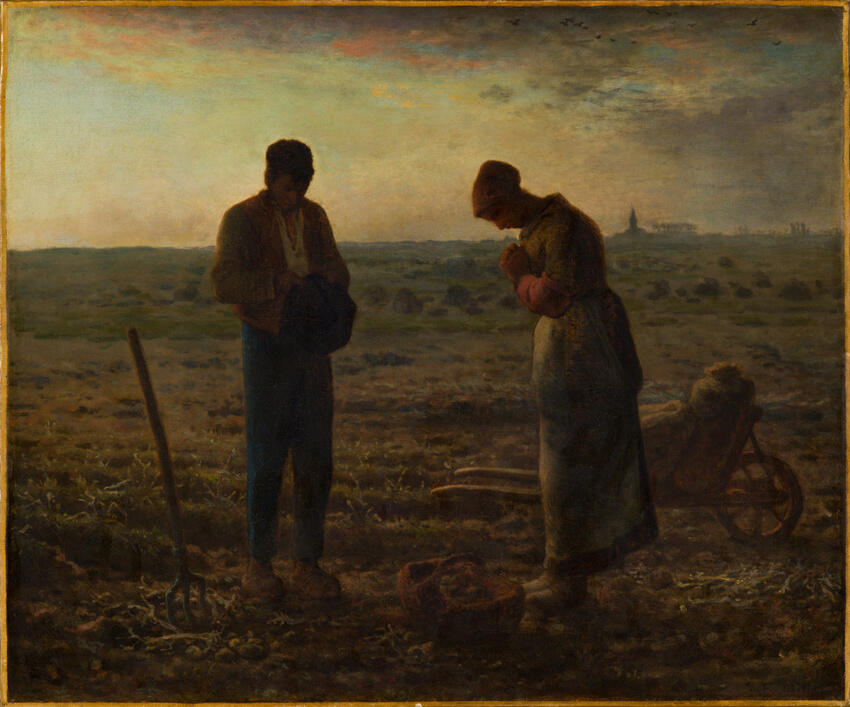 A man and woman in a field at the end of the day, heads bowed in prayer as the bells of a church in the distance ring 6pm Angelus.