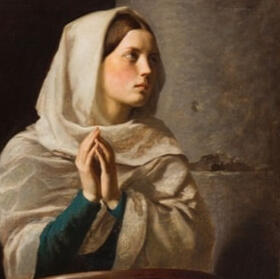 A young woman in a shawl folds her hands in prayer at a prie-dieu in a church.